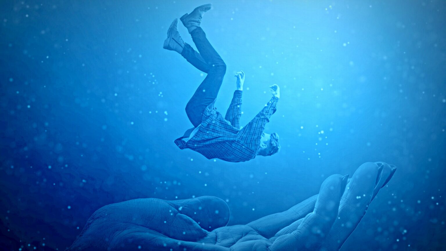 Mann fällt in Hand mystisch dunkel verschwommen fallen